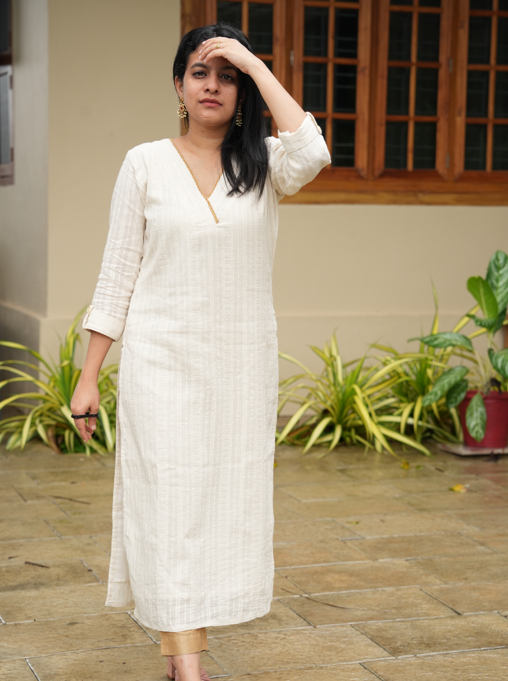 off-white cotton kurti with golden lace detailing on the neck